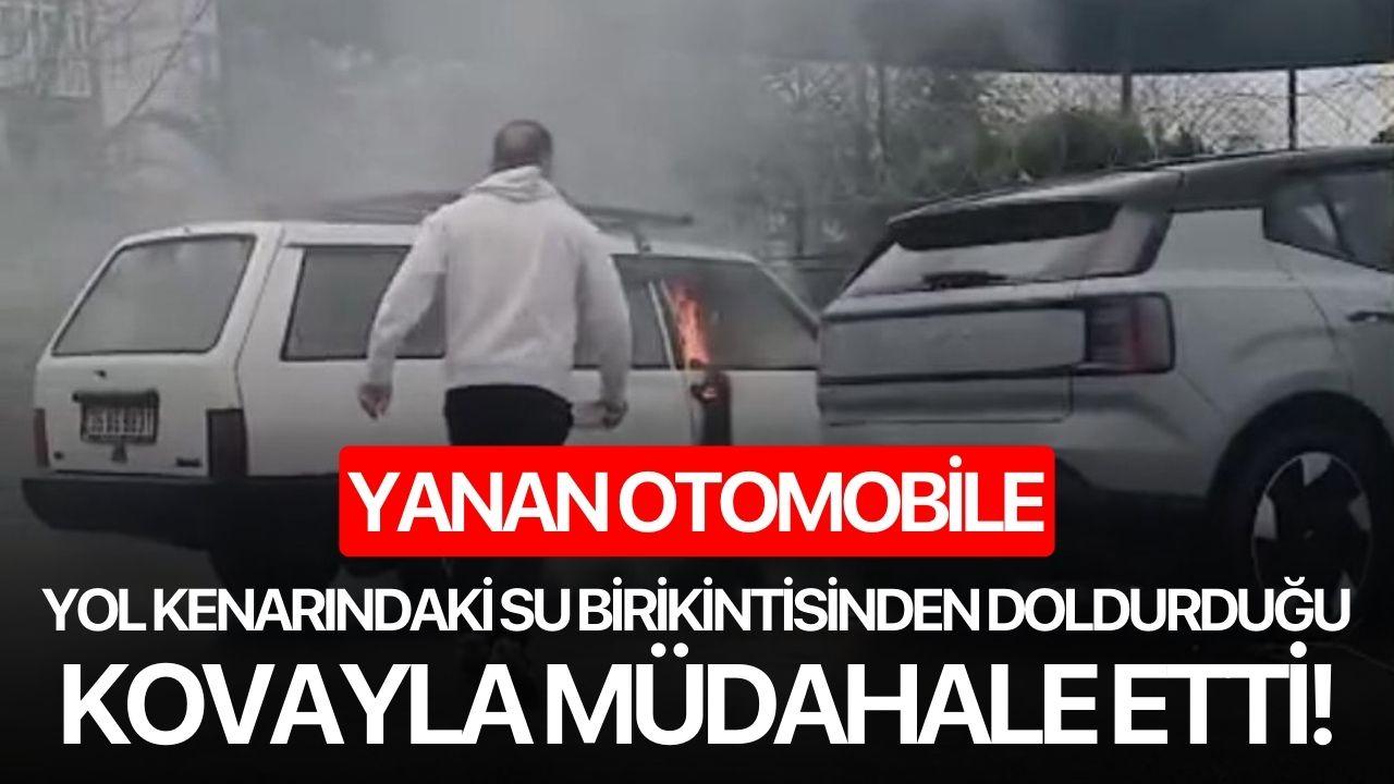 Yanan otomobile yol kenarındaki su birikintisinden doldurduğu kovayla müdahale etti!