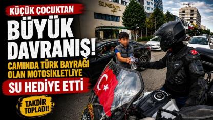Su satan çocuk, camında Türk bayrağı olan motosikletliye su hediye etmek istedi